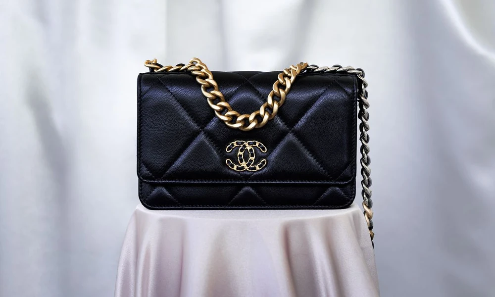 Chanel 19 bag with bold quilting and a chain strap.
