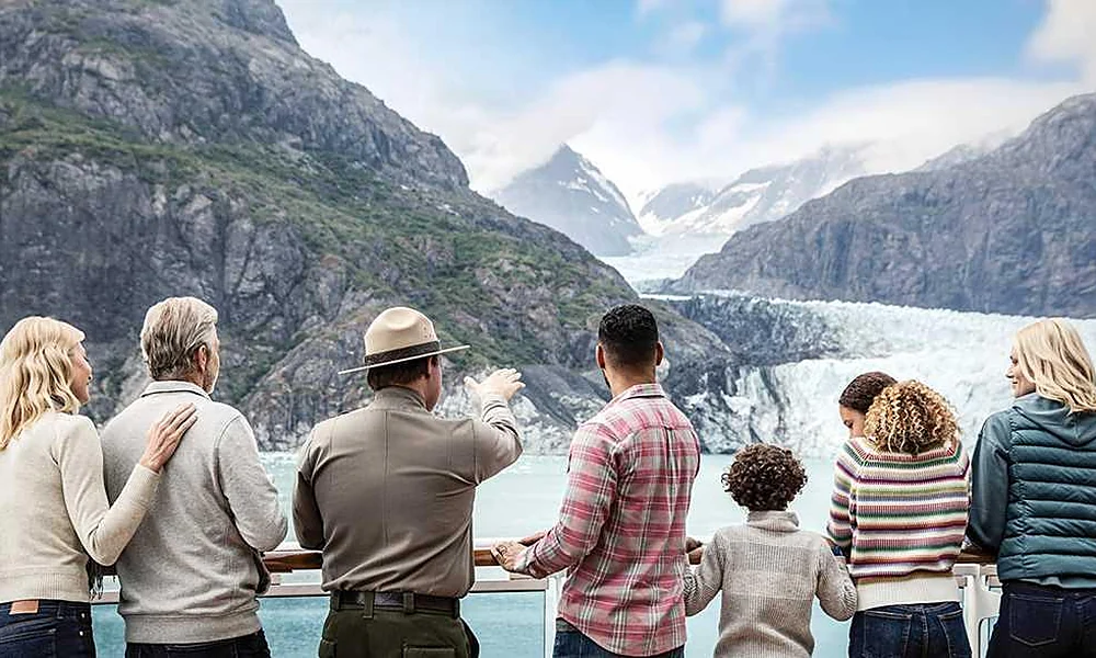 Multigenerational family viewing Alaska glaciers from a cruise ship