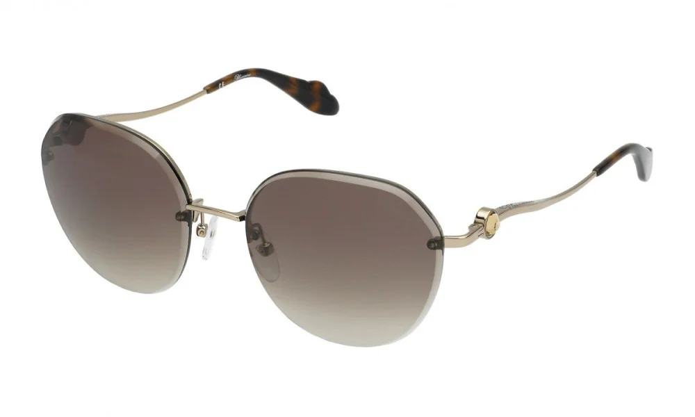 Gold-tone rimless sunglasses with oversized oval brown gradient lenses and slim curved arms, shown against a white background; elegant, understated style.