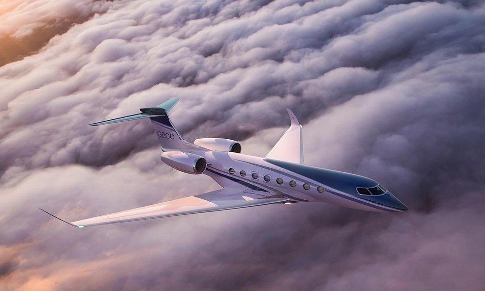 Gulfstream G800 ultra-long-range business jet soaring gracefully above a thick blanket of clouds