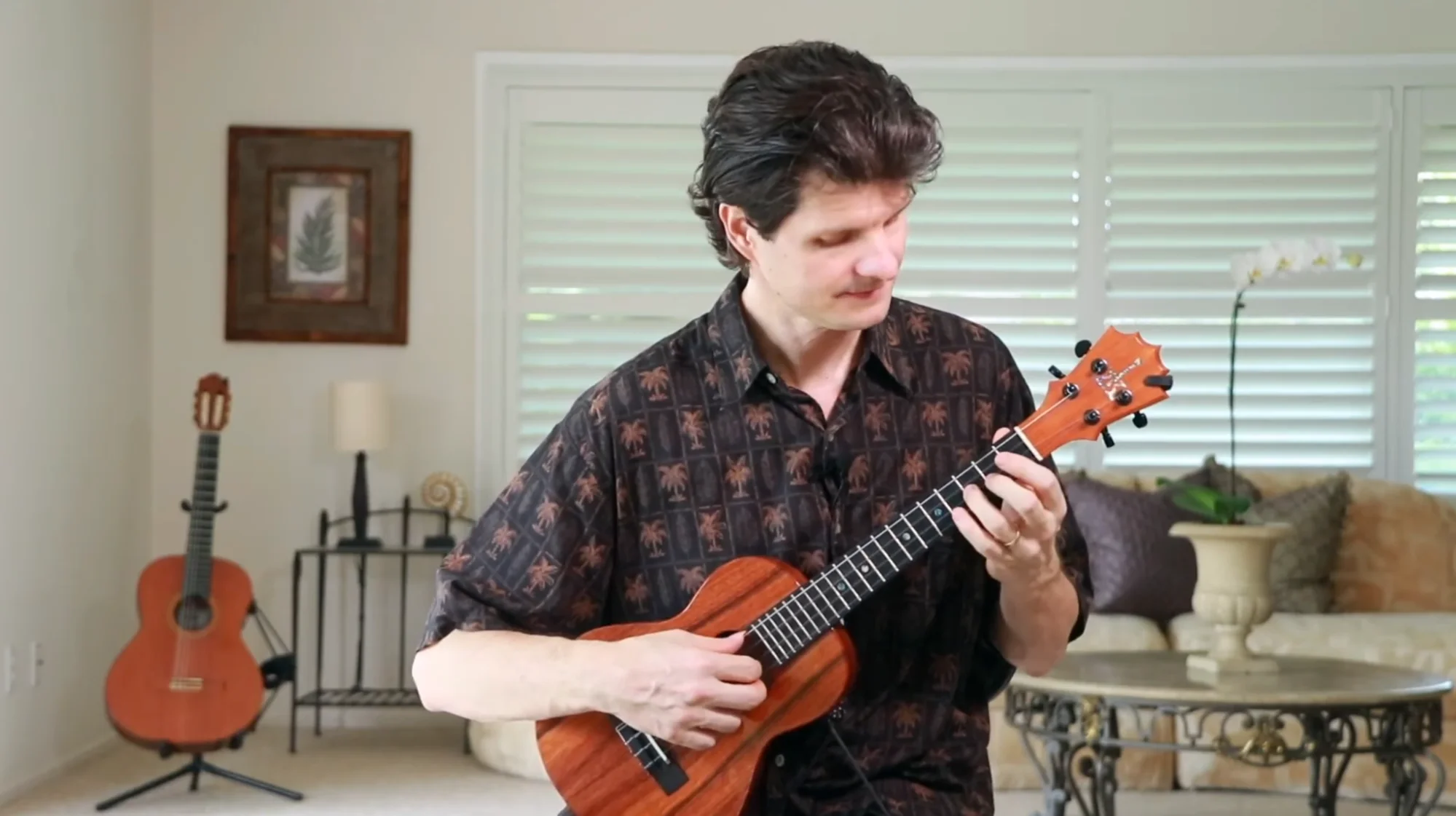 Musician playing an acoustic guitar during a session
