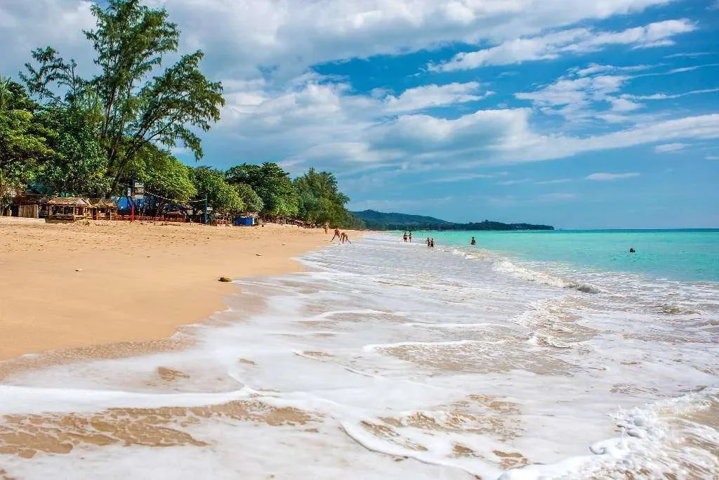 Gentle ocean waves rolling onto a pristine sandy shore