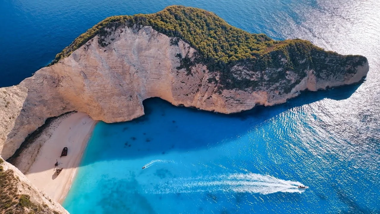 Overhead view of dramatic cliffs and blue cove