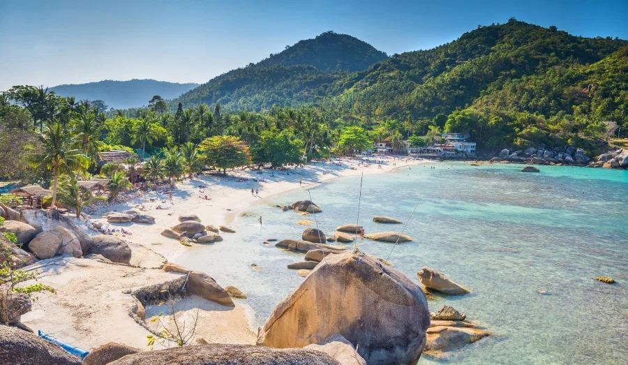 Wide panoramic view of a sunny tropical cove and sea