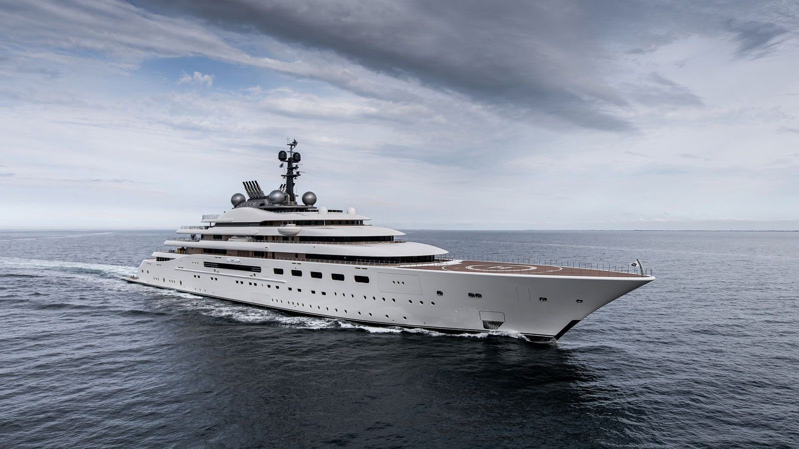 Side profile view of a large luxury yacht vessel