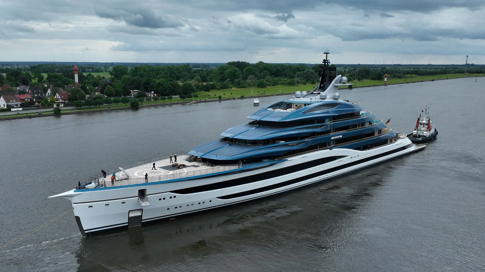 Luxury yacht anchored near a scenic coastal area