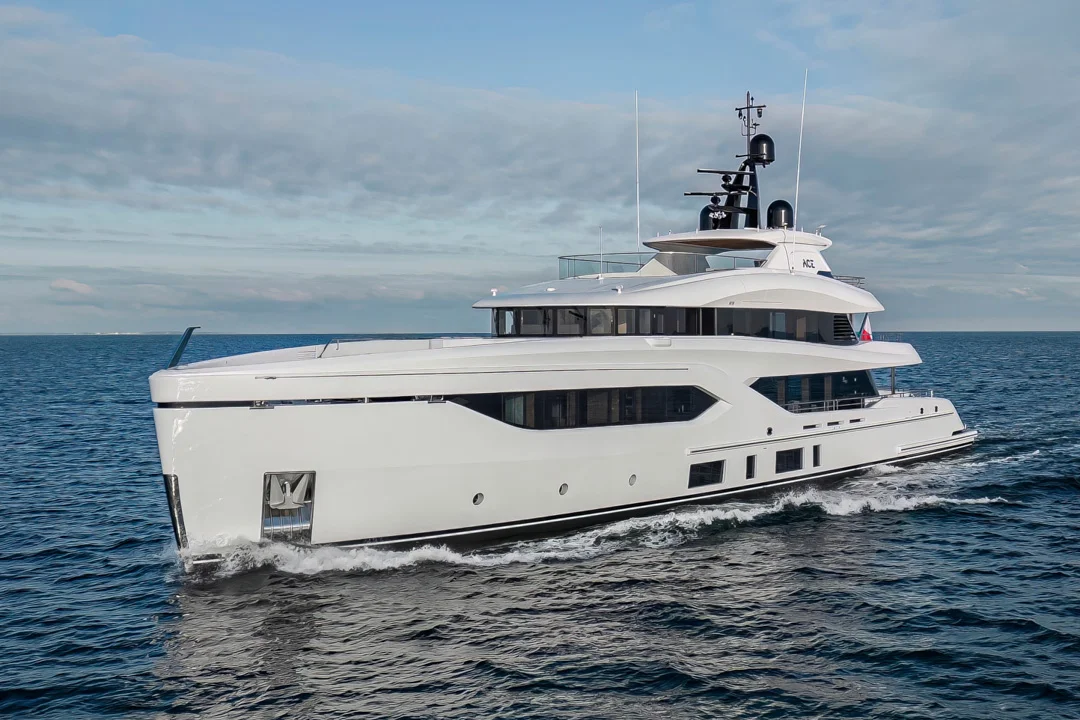 Premium custom superyacht underway in clear sea