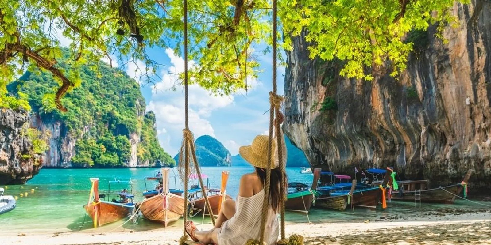 Palm trees framing a view of clear ocean waters