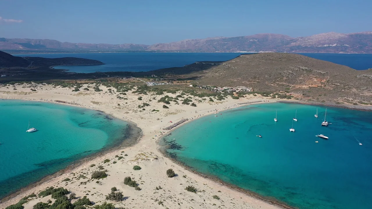 Narrow sand strip connecting two turquoise bays