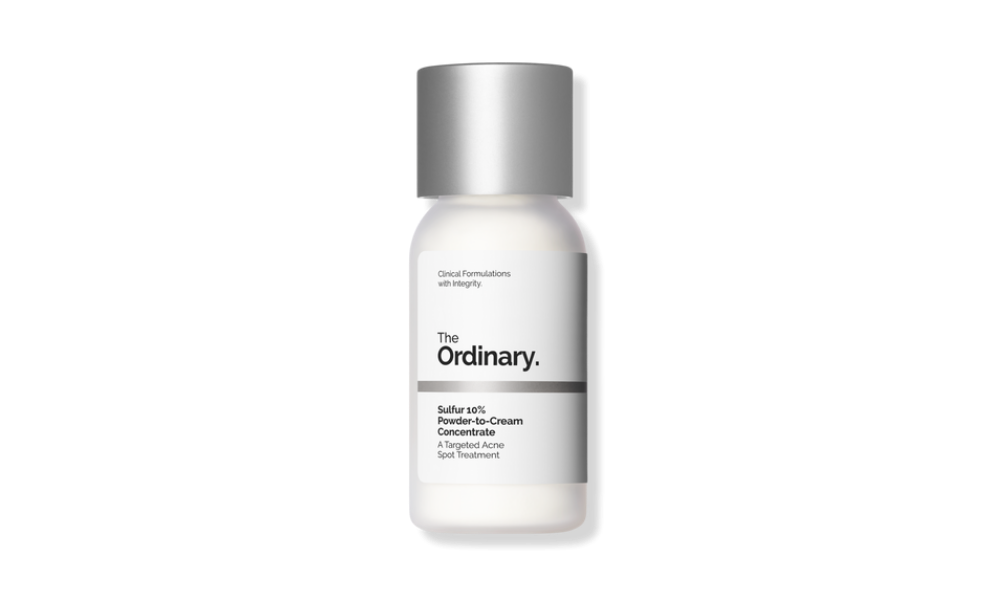 The Ordinary skincare serum bottle on a black background, with a silver cap and minimalist white label; its clinical design feels clean and understated.