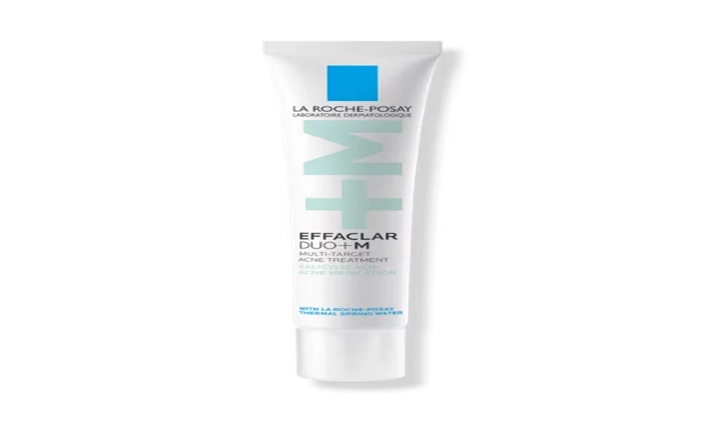 La Roche-Posay Effaclar Duo+ acne treatment tube stands beside its white box with blue accents on a plain background, conveying a clean, clinical look.