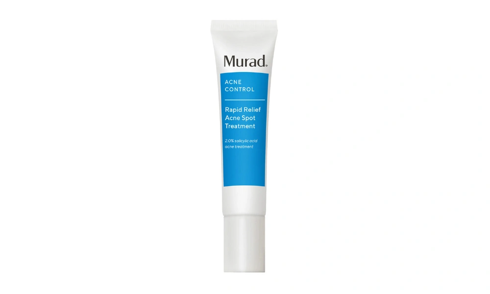 A white tube of Murad Rapid Relief Acne Spot Treatment with a blue label stands upright against a plain white background, conveying a clean, clinical skincare tone.