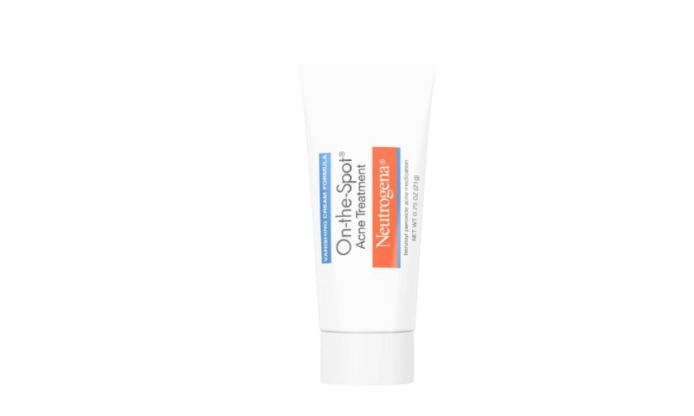 Two Neutrogena On-the-Spot Acne Treatment boxes sit side by side on a gray surface, displaying vanishing cream formula and clinically proven power.